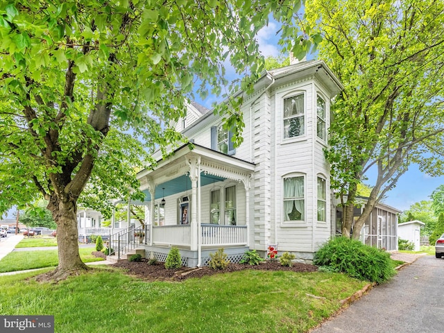36 Fulton Ave, Walkersville, MD 21793 - italianate home with a front yard and a porch