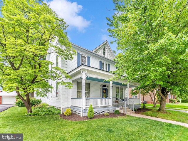 36 Fulton Ave, Walkersville, MD 21793 - view of front of property featuring covered porch and a front lawn
