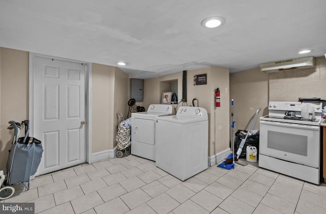 laundry area featuring baseboards, recessed lighting, light tile patterned flooring, laundry area, and washing machine and clothes dryer