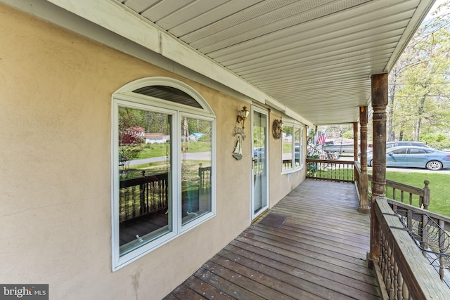 wooden deck featuring covered porch