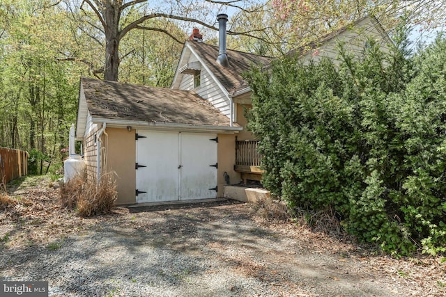 view of shed with fence