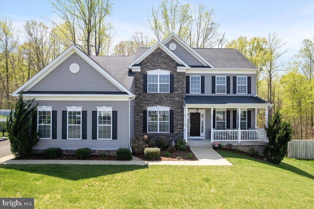 1230 Fairwood Dr, Huntingtown, MD 20639 - view of front facade with a porch, roof with shingles, and a front yard