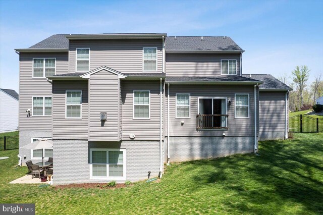 1230 Fairwood Dr, Huntingtown, MD 20639 - rear view of house with a lawn, fence, and a patio area