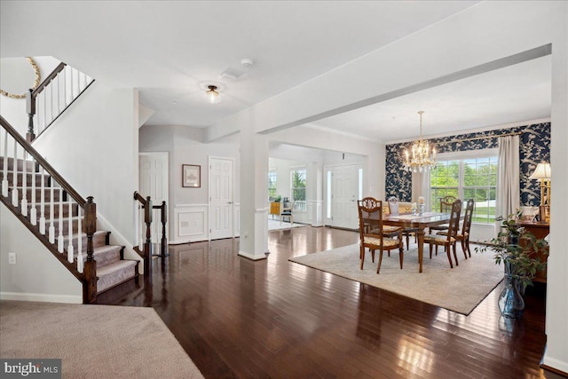 1230 Fairwood Dr, Huntingtown, MD 20639 - dining room featuring stairway, baseboards, an inviting chandelier, and hardwood / wood-style flooring