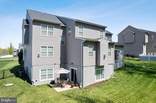 1230 Fairwood Dr, Huntingtown, MD 20639 - rear view of house featuring a lawn, fence, a patio, and cooling unit