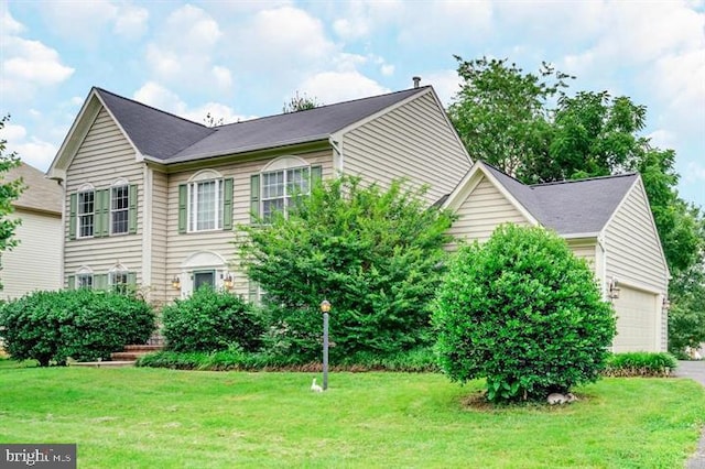 10457 Pineview Rd, Manassas, VA 20111 - view of home's exterior with an attached garage and a yard