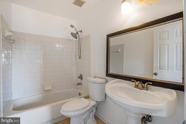 9403 Robin Lee Ct, Manassas Park, VA 20111 - bathroom featuring toilet, a sink, and washtub / shower combination