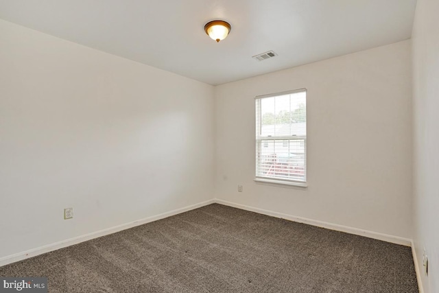 9403 Robin Lee Ct, Manassas Park, VA 20111 - empty room featuring dark colored carpet and baseboards