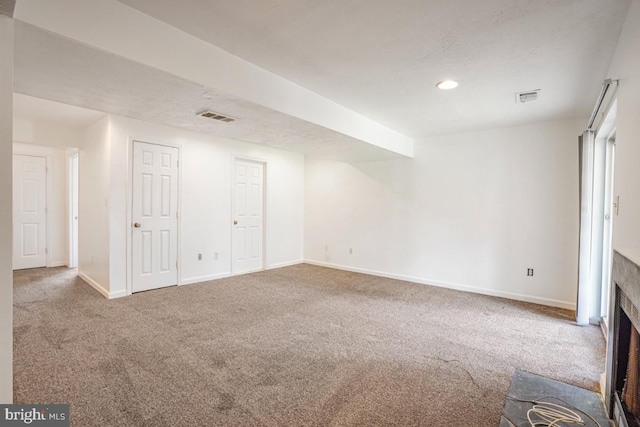 9403 Robin Lee Ct, Manassas Park, VA 20111 - unfurnished living room with carpet flooring, baseboards, recessed lighting, and a fireplace with flush hearth