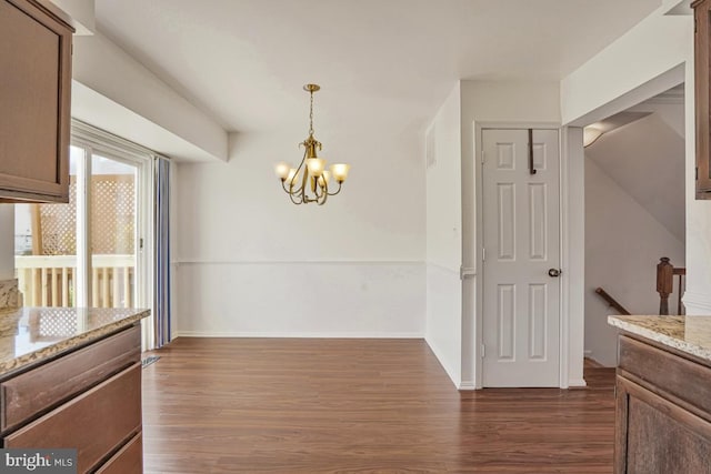 9403 Robin Lee Ct, Manassas Park, VA 20111 - unfurnished dining area featuring dark wood finished floors, a chandelier, and baseboards