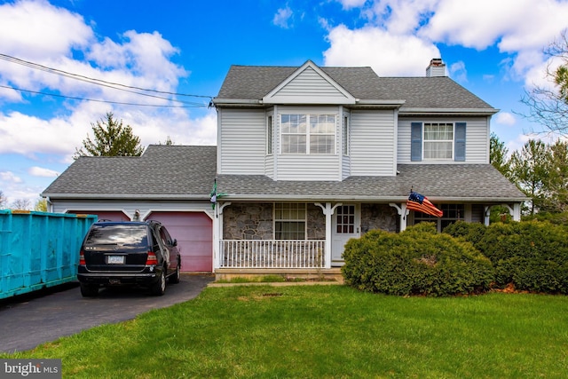 327 E Branch Rd, Sellersville, PA 18960 - traditional-style home featuring stone siding, an attached garage, aphalt driveway, a porch, and a front yard