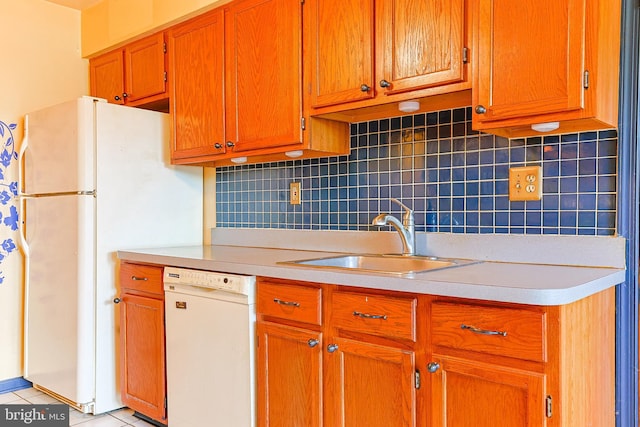 327 E Branch Rd, Sellersville, PA 18960 - kitchen with a sink, light countertops, white appliances, brown cabinets, and decorative backsplash