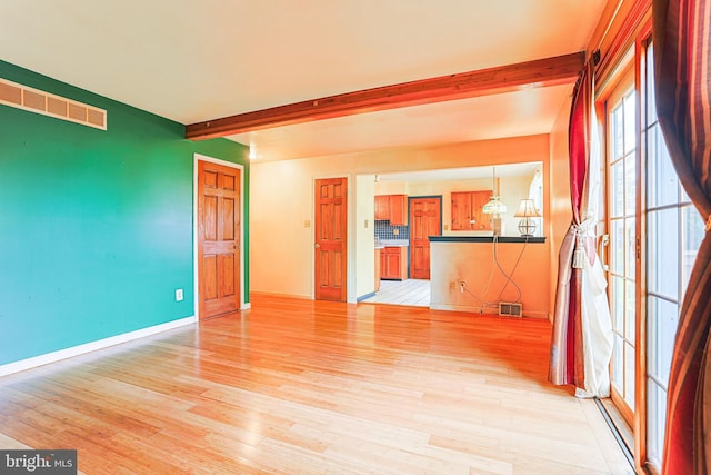 327 E Branch Rd, Sellersville, PA 18960 - unfurnished room featuring beamed ceiling, light wood-style flooring, visible vents, and baseboards