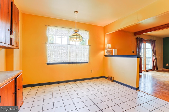 327 E Branch Rd, Sellersville, PA 18960 - unfurnished dining area featuring visible vents, baseboards, beam ceiling, and light tile patterned floors