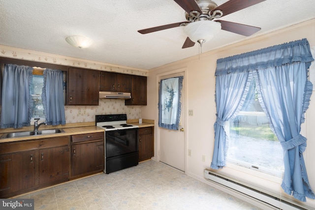 kitchen with range with electric cooktop, dark brown cabinets, a sink, a baseboard radiator, and under cabinet range hood