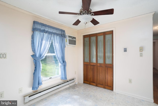 spare room with ceiling fan, baseboard heating, baseboards, a wall unit AC, and ornamental molding