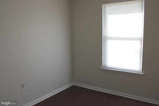 17 Rozina Ct, Owings Mills, MD 21117 - empty room with dark wood-style flooring and baseboards