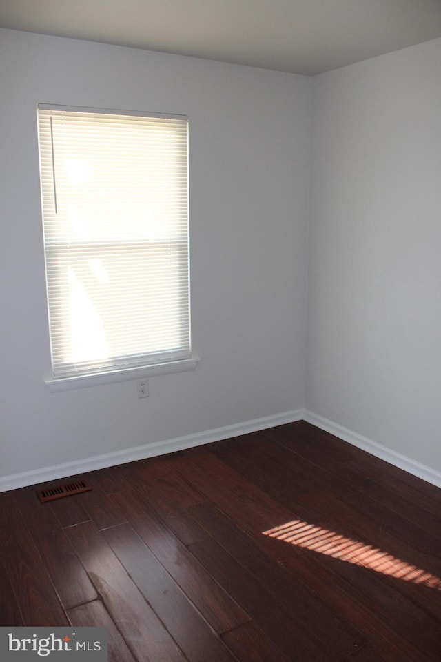 17 Rozina Ct, Owings Mills, MD 21117 - spare room featuring visible vents, baseboards, and hardwood / wood-style floors