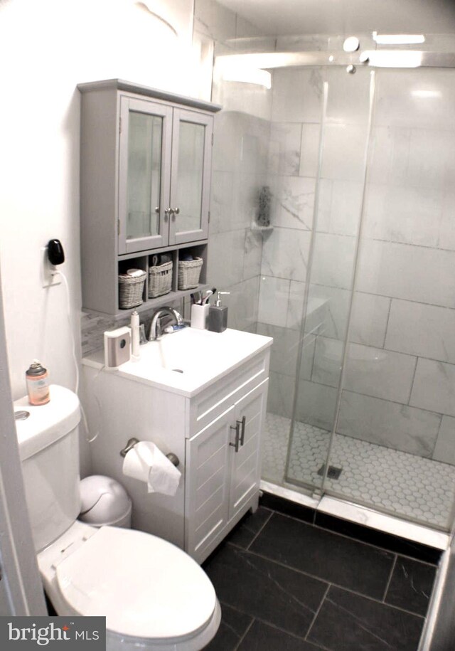 17 Rozina Ct, Owings Mills, MD 21117 - bathroom with toilet, a stall shower, and vanity