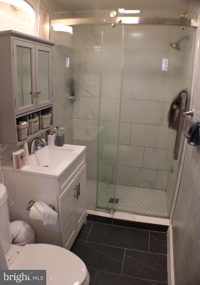 17 Rozina Ct, Owings Mills, MD 21117 - bathroom with toilet, a shower stall, and vanity