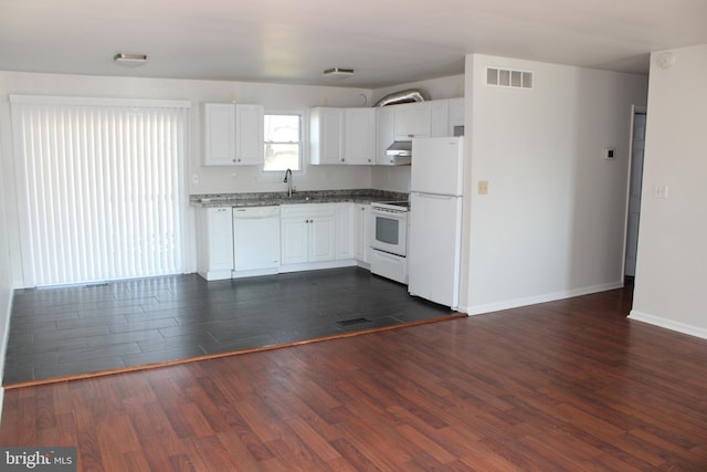 17 Rozina Ct, Owings Mills, MD 21117 - kitchen with dark wood finished floors, white appliances, visible vents, under cabinet range hood, and a sink