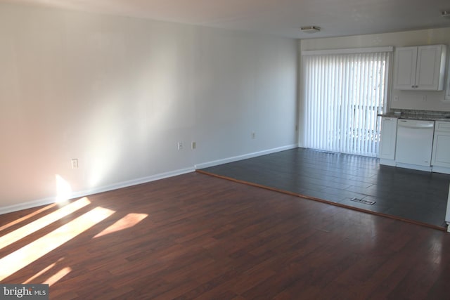 17 Rozina Ct, Owings Mills, MD 21117 - unfurnished living room featuring visible vents, baseboards, and dark wood-style floors