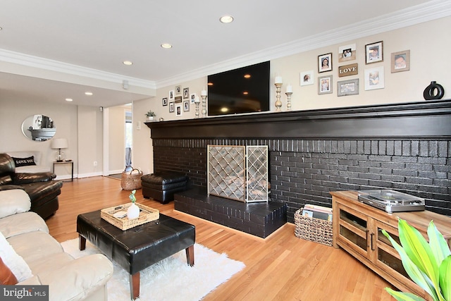 6704 Emporia Ct, Springfield, VA 22152 - living area featuring crown molding, a fireplace, wood finished floors, and recessed lighting