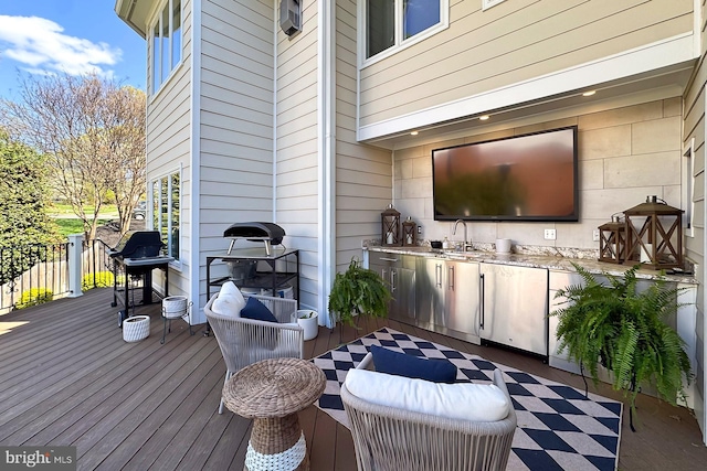 6704 Emporia Ct, Springfield, VA 22152 - wooden deck featuring exterior kitchen, a sink, and area for grilling
