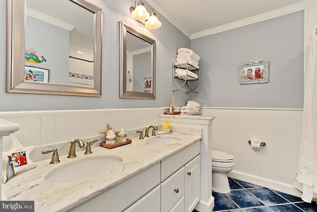 6704 Emporia Ct, Springfield, VA 22152 - bathroom with ornamental molding, a wainscoted wall, toilet, and double vanity