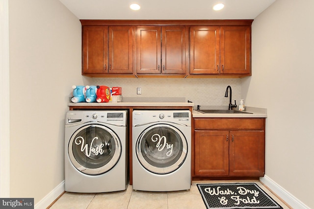 6704 Emporia Ct, Springfield, VA 22152 - laundry room featuring separate washer and dryer, cabinet space, baseboards, recessed lighting, and light tile patterned floors