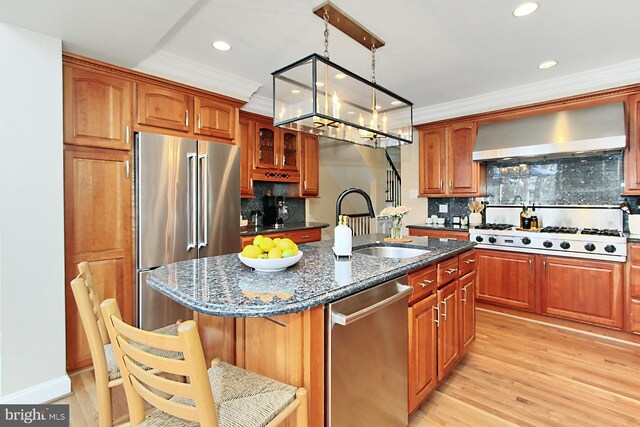 6704 Emporia Ct, Springfield, VA 22152 - kitchen with wall chimney exhaust hood, stainless steel appliances, backsplash, dark stone countertops, and a sink