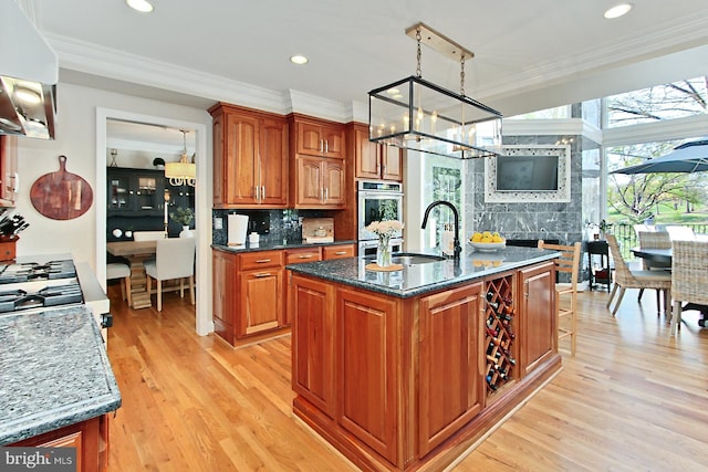 6704 Emporia Ct, Springfield, VA 22152 - kitchen with a sink, a chandelier, tasteful backsplash, ornamental molding, and dark stone countertops