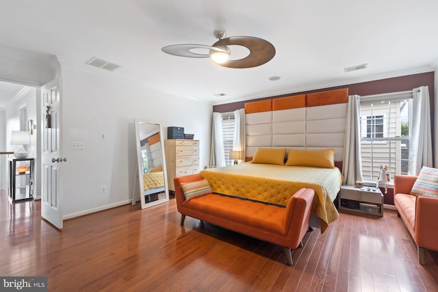 bedroom with crown molding, multiple windows, wood finished floors, baseboards, and ceiling fan