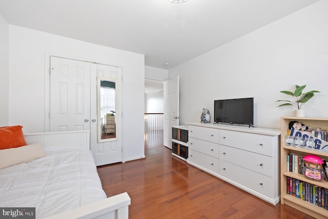 bedroom with wood finished floors