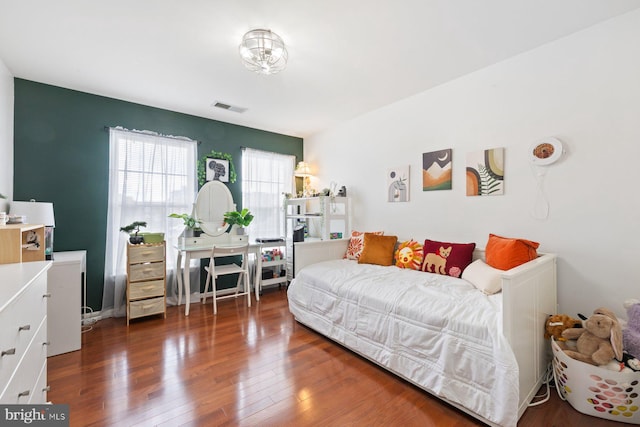 bedroom featuring wood finished floors