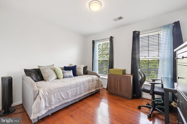bedroom with hardwood / wood-style flooring