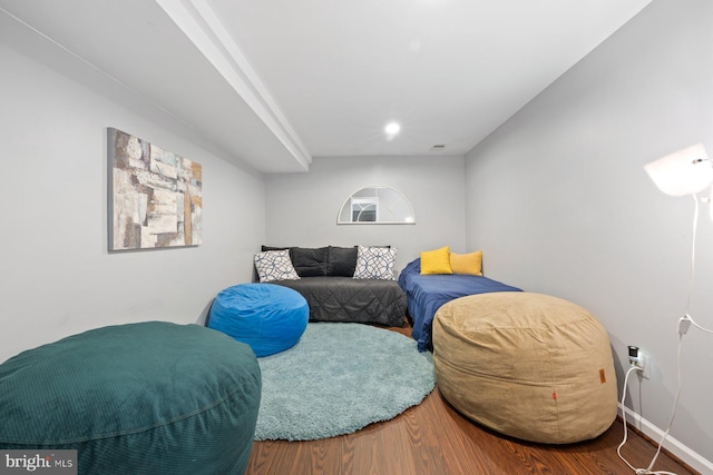 sitting room with wood finished floors and baseboards