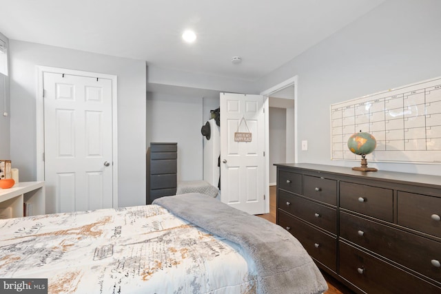 bedroom with wood finished floors
