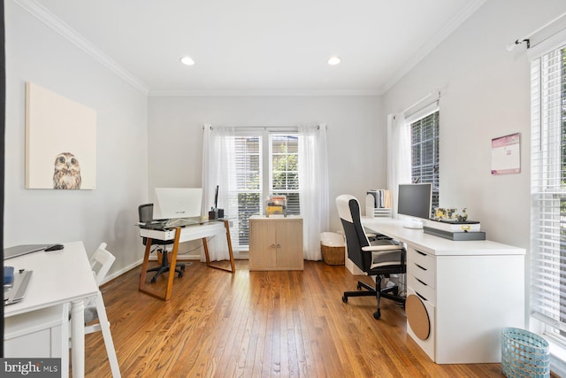 home office with light wood-style floors, ornamental molding, and recessed lighting