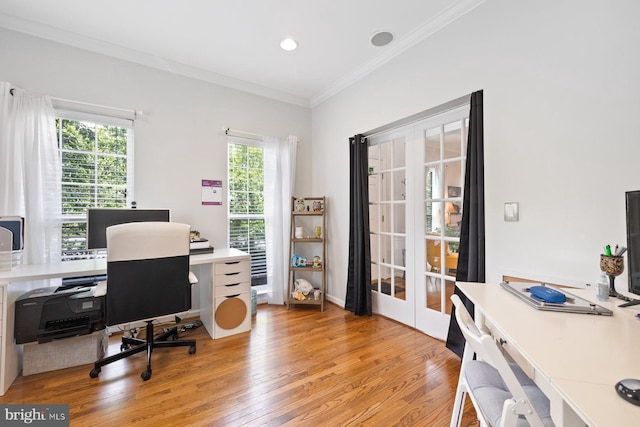 home office featuring french doors, light wood-style floors, crown molding, and recessed lighting