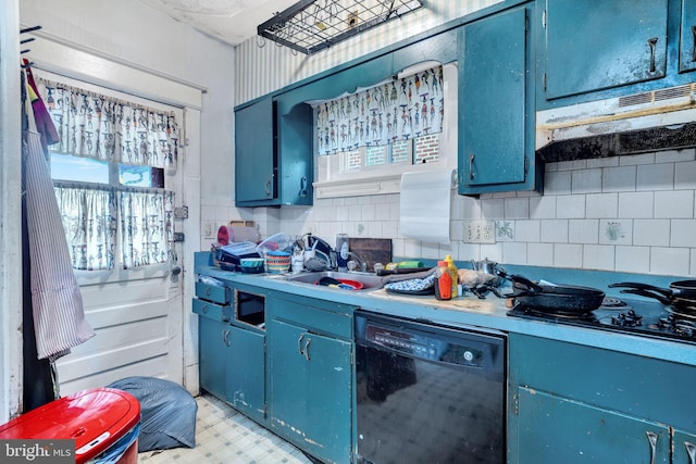 kitchen featuring blue cabinets, black appliances, a wealth of natural light, and under cabinet range hood