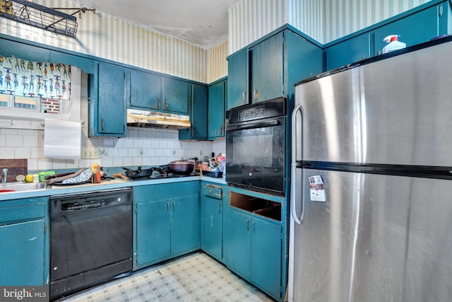 kitchen with tasteful backsplash, blue cabinetry, light floors, under cabinet range hood, and black appliances