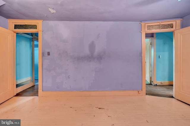 unfurnished room featuring hardwood / wood-style floors