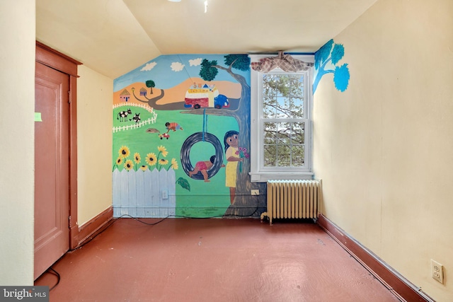 interior space featuring radiator heating unit and vaulted ceiling