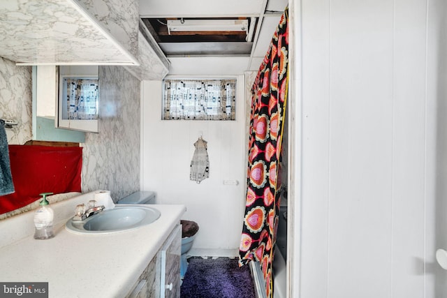 full bathroom with toilet, vanity, and a shower with curtain
