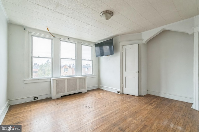 3905 L St, Philadelphia, PA 19124 - bonus room featuring hardwood / wood-style floors, radiator, and baseboards