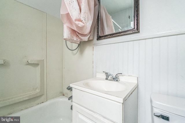 3905 L St, Philadelphia, PA 19124 - bathroom with a wainscoted wall, vanity, shower / bathing tub combination, and toilet