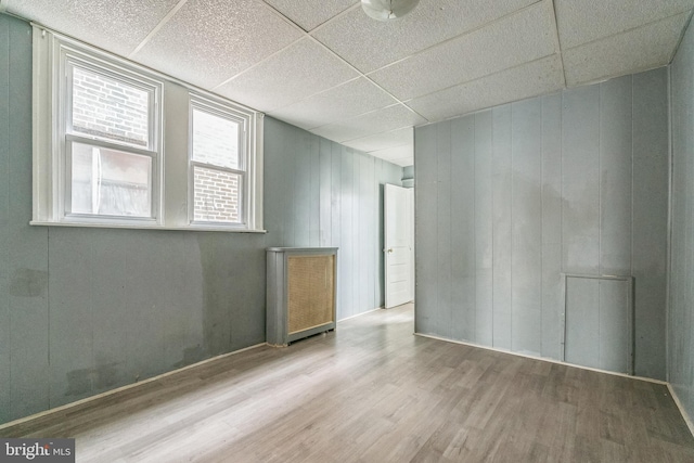 3905 L St, Philadelphia, PA 19124 - spare room featuring wooden walls, a paneled ceiling, and wood finished floors