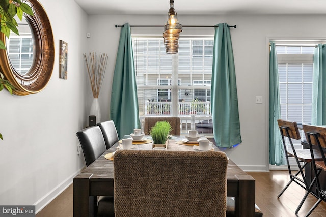 7204 Wood Trail Dr, Lanham, MD 20706 - dining space featuring a healthy amount of sunlight, baseboards, and dark wood finished floors