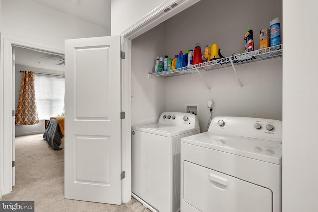 7204 Wood Trail Dr, Lanham, MD 20706 - clothes washing area with washing machine and dryer, laundry area, and light carpet